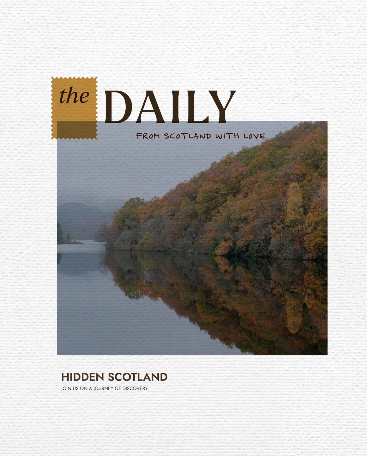 The Daily for 21 October, from Scotland with love. a small wooded island reflected in a misty loch, autumn forest and hills along the far shore