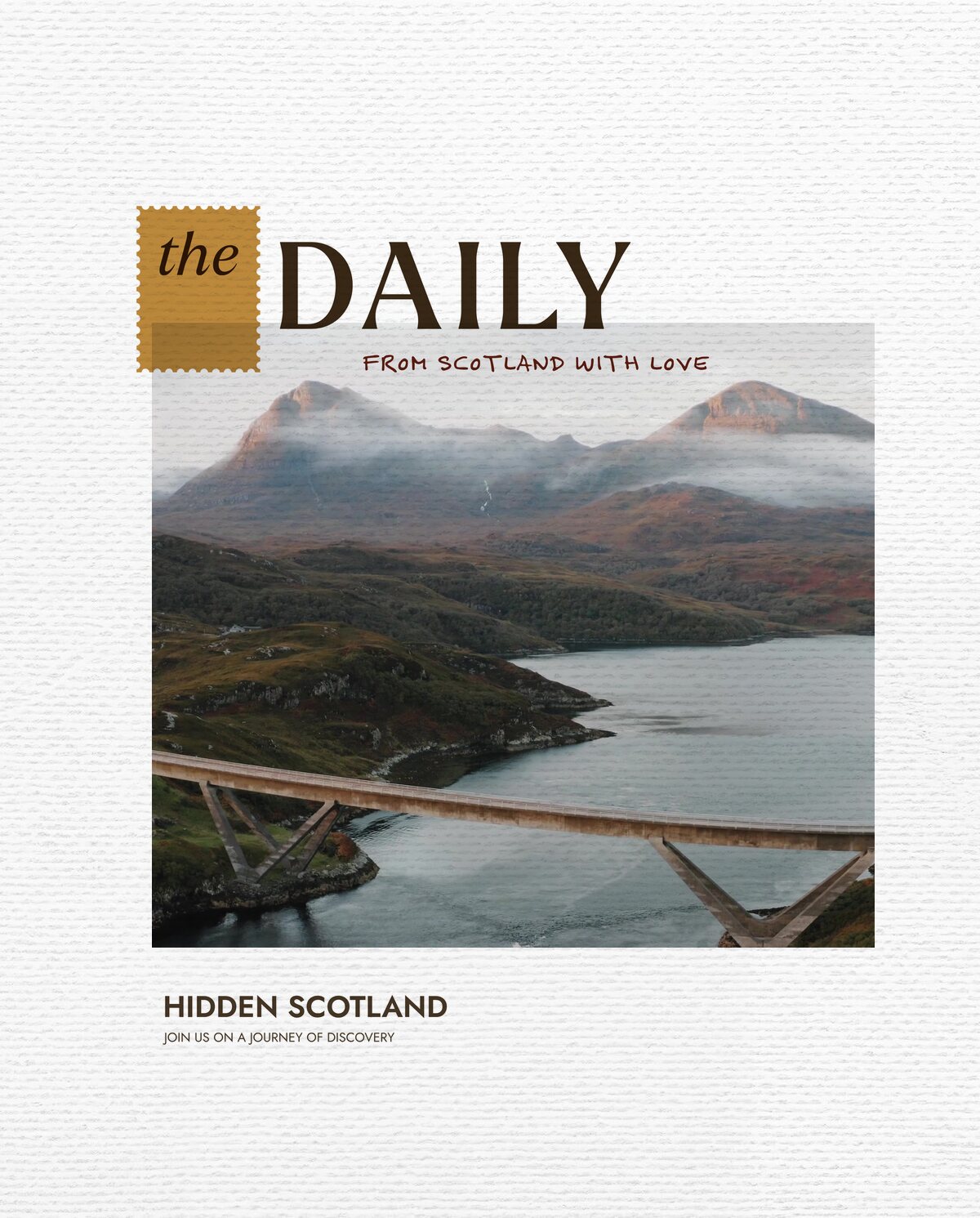 The Daily for 23 October, from Scotland with love. Aerial view of a concrete road bridge with angled supports spanning a sea loch, twin cloud-wrapped mountain peaks rising behind autumn-coloured hills.