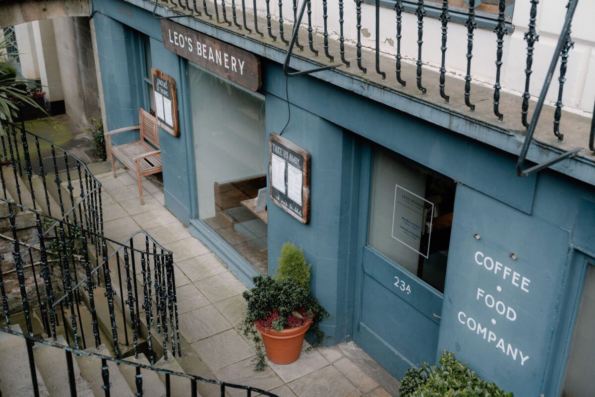 Blue-fronted Leo's Beanery shopfront at 234, coffee food company lettering on window