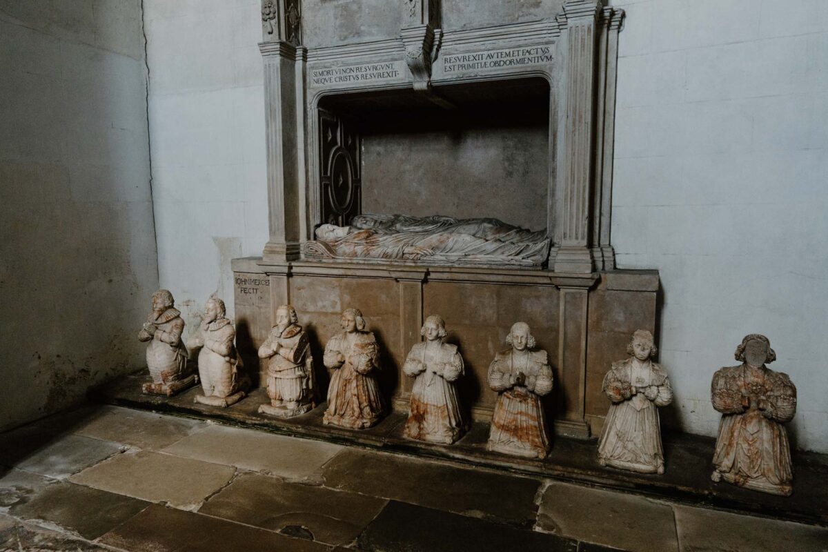 The alabaster monument to Sir George Bruce with his children kneeling before it, Culross Abbey.