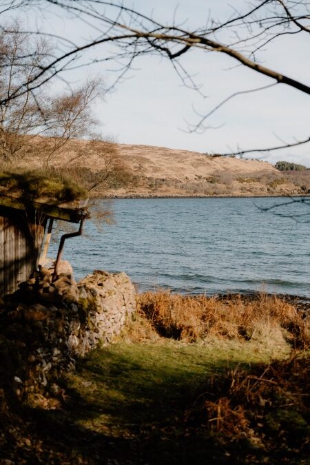 Kyle Rhea seen through bare trees from the path to the otter hide, the mainland hills beyond.